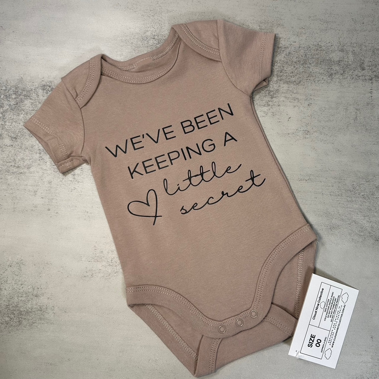 We've Been Keeping A Little Secret | Baby Onesie | Size 0000 & 00 (SALE)