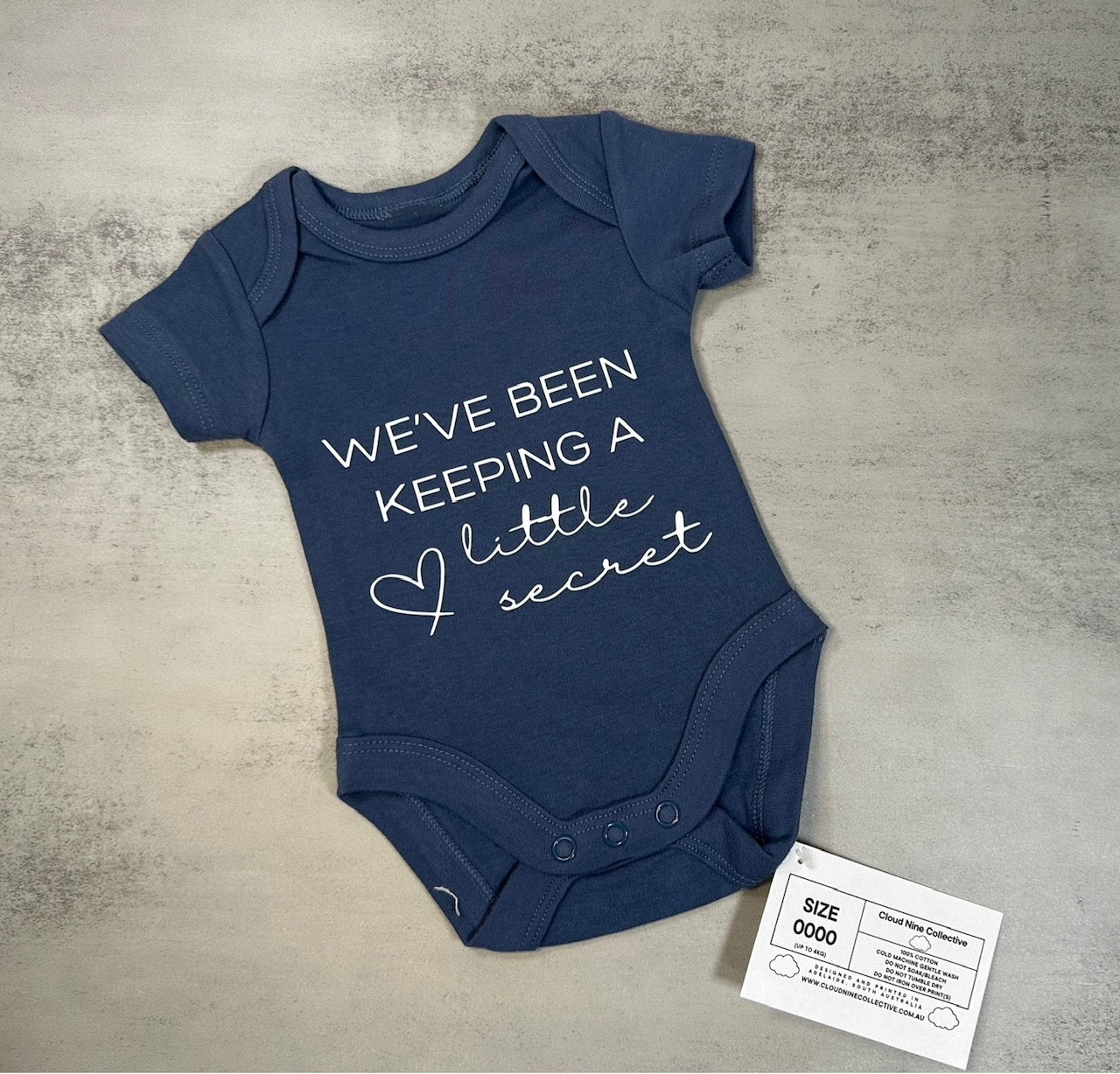 We've Been Keeping A Little Secret | Baby Onesie | Size 0000 & 00 (SALE)